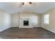 Spacious living room with vaulted ceiling, fireplace, and hardwood floors at 5382 Kemper Pl, Stone Mountain, GA 30088