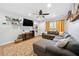 Living room with L-shaped sectional and hardwood floors at 1824 Evans Sw Dr, Atlanta, GA 30310