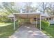 Covered carport with concrete driveway at 1703 Barrett Nw Dr, Atlanta, GA 30318