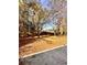 Spacious backyard with mature trees and a large grassy area at 2815 Highway 20 Se, Conyers, GA 30013