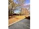Spacious backyard with mature trees and a large grassy area at 2815 Highway 20 Se, Conyers, GA 30013