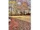 Spacious backyard with mature trees and a large grassy area at 2815 Highway 20 Se, Conyers, GA 30013