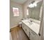 Updated bathroom with quartz countertop, new fixtures, and modern flooring at 2815 Highway 20 Se, Conyers, GA 30013