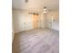 Spacious bedroom with new carpet, barn door, and ceiling fan at 2815 Highway 20 Se, Conyers, GA 30013