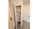 Open shelving in closet with additional storage at 2815 Highway 20 Se, Conyers, GA 30013