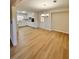 Bright dining room with kitchen view and light oak laminate flooring at 2815 Highway 20 Se, Conyers, GA 30013