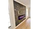 Modern electric fireplace with marble surround and light oak flooring at 2815 Highway 20 Se, Conyers, GA 30013