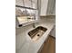 Modern kitchen sink with quartz countertop and updated faucet at 2815 Highway 20 Se, Conyers, GA 30013