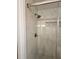 Shower stall with marble-look tile and pebble floor at 2815 Highway 20 Se, Conyers, GA 30013