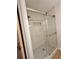 Walk-in shower with marble tile and glass door at 2815 Highway 20 Se, Conyers, GA 30013