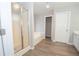 Bathroom featuring a shower, garden tub, and vinyl flooring at 7397 Basalt Dr, Union City, GA 30291