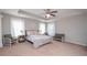 Spacious main bedroom with carpeted floor and ceiling fan at 7397 Basalt Dr, Union City, GA 30291