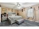 Main bedroom with a king-size bed and stylish silver accents at 916 Marshall Fuller Rd, Dallas, GA 30157