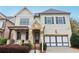 Two-story house with stone accents and a large front yard at 3329 Stetson Overlook Se, Smyrna, GA 30080