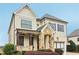 Beige two-story house with gray shutters and stone accents at 3329 Stetson Overlook Se, Smyrna, GA 30080