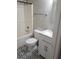 Bathroom with white vanity, patterned floor, and tub shower at 1651 Massachusetts Sw Ave # 20, Marietta, GA 30008