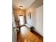 Light and bright entryway with bench and hardwood floors at 3393 Fernview Dr, Lawrenceville, GA 30044