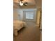 Main bedroom with ceiling fan and neutral carpeting at 340 Auburn Valley Way, Auburn, GA 30011