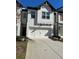 Two-story home with white brick exterior and a two-car garage at 340 Auburn Valley Way, Auburn, GA 30011