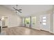 Bright living room with hardwood floors, vaulted ceiling and large windows at 2627 Elsinore St, East Point, GA 30344