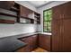 Laundry room with dark wood cabinets and quartz countertops at 287 Mountain View Nw Rdg, Marietta, GA 30064