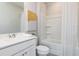 Clean bathroom with white vanity, shower/tub combo and white tile at 363 Skylar Se Way, Atlanta, GA 30315