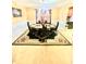 Bright dining room with a table for four and decorative chandelier at 408 Othello Dr, Hampton, GA 30228