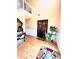 Elegant entryway with hardwood floors, a console table, and double doors at 408 Othello Dr, Hampton, GA 30228
