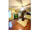 Living room featuring hardwood floors, a fireplace, and a large TV at 408 Othello Dr, Hampton, GA 30228