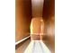 Indoor staircase with brown walls and patterned runner at 408 Othello Dr, Hampton, GA 30228