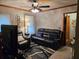 Living room with leather furniture and ceiling fan at 1614 Flintwood Se Dr, Atlanta, GA 30316