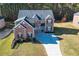 Two-story home, large backyard, and a long driveway at 168 Waypoint Dr, Stockbridge, GA 30281