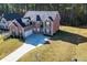 Brick house with a three-car garage and large yard at 168 Waypoint Dr, Stockbridge, GA 30281