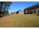 View of homes and grassy backyard at 168 Waypoint Dr, Stockbridge, GA 30281