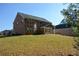 Brick house with large backyard and trees at 168 Waypoint Dr, Stockbridge, GA 30281