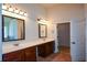 Double vanity bathroom with a large mirror and ample storage at 168 Waypoint Dr, Stockbridge, GA 30281