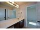 Bathroom with vanity, large mirror, and access to bedrooms at 168 Waypoint Dr, Stockbridge, GA 30281