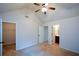 Bright bedroom with high ceilings, ceiling fan, and en-suite bathroom access at 168 Waypoint Dr, Stockbridge, GA 30281