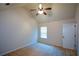 Spacious bedroom with vaulted ceiling, ceiling fan, and walk-in closet at 168 Waypoint Dr, Stockbridge, GA 30281