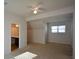 Bright bedroom with vaulted ceiling, ceiling fan and en-suite bathroom at 168 Waypoint Dr, Stockbridge, GA 30281
