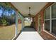 Covered patio overlooks backyard and wooded area at 168 Waypoint Dr, Stockbridge, GA 30281