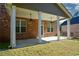 Brick house with covered patio and ceiling fans at 168 Waypoint Dr, Stockbridge, GA 30281