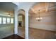 Formal dining room featuring a tray ceiling, chandelier, and hardwood floors at 168 Waypoint Dr, Stockbridge, GA 30281