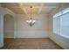 Dining room with tray ceiling, chandelier, and wainscoting at 168 Waypoint Dr, Stockbridge, GA 30281