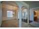 Open dining room with coffered ceiling and arched passageway at 168 Waypoint Dr, Stockbridge, GA 30281