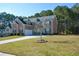 Two story brick home with a three-car garage at 168 Waypoint Dr, Stockbridge, GA 30281