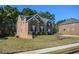 Two-story brick home with a landscaped yard at 168 Waypoint Dr, Stockbridge, GA 30281