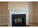 Elegant fireplace with white mantel and black surround at 168 Waypoint Dr, Stockbridge, GA 30281