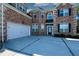 Two-car garage with white doors and brick exterior at 168 Waypoint Dr, Stockbridge, GA 30281