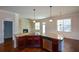 Spacious kitchen with granite countertops and dark wood cabinets at 168 Waypoint Dr, Stockbridge, GA 30281